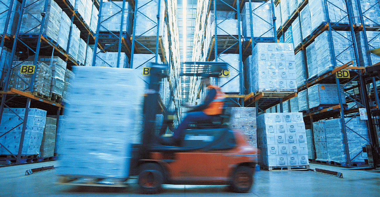 Man Operating Forklift in Warehouse