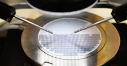 Semiconductor silicon wafer undergoing probe testing Semiconductor silicon wafer undergoing probe testing
