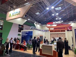 Visitors interacting at Ample Solutions’ booth. Visitors interacting at Ample Solutions’ booth.